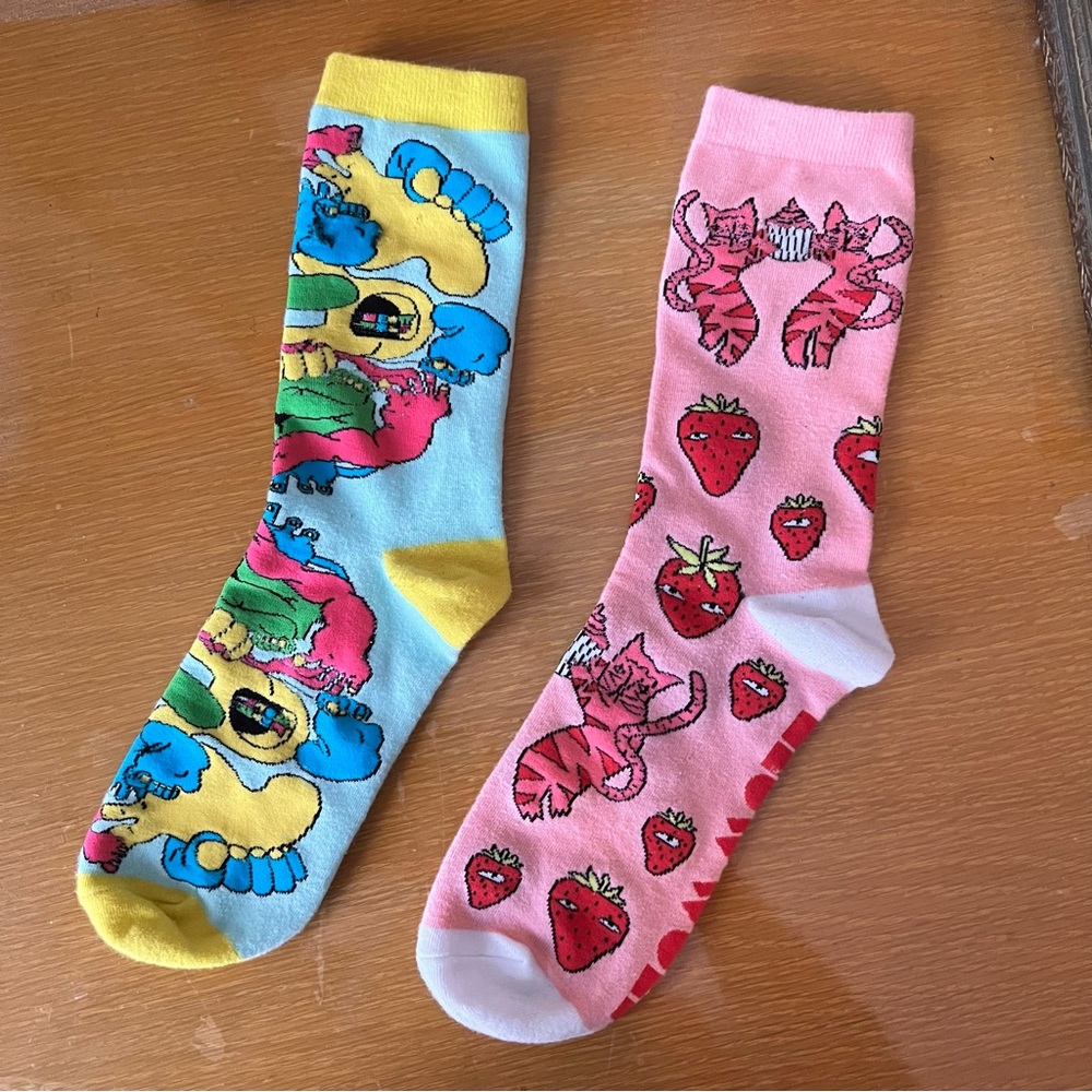 Playfully colorful purposefully mismatched Meow Wolf socks